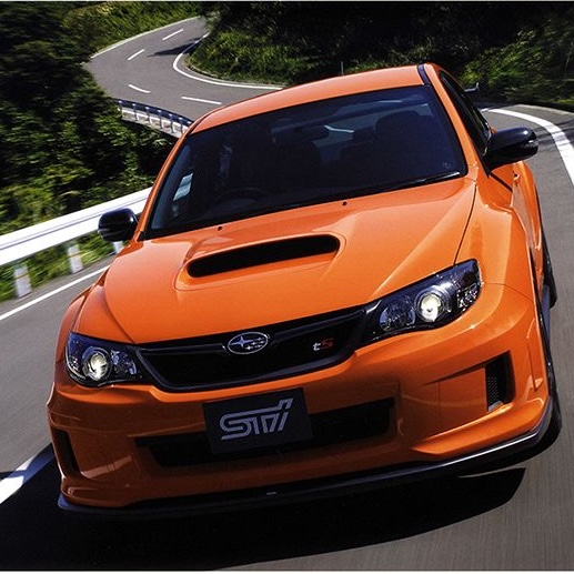 Subaru Impreza hatchback on a city street